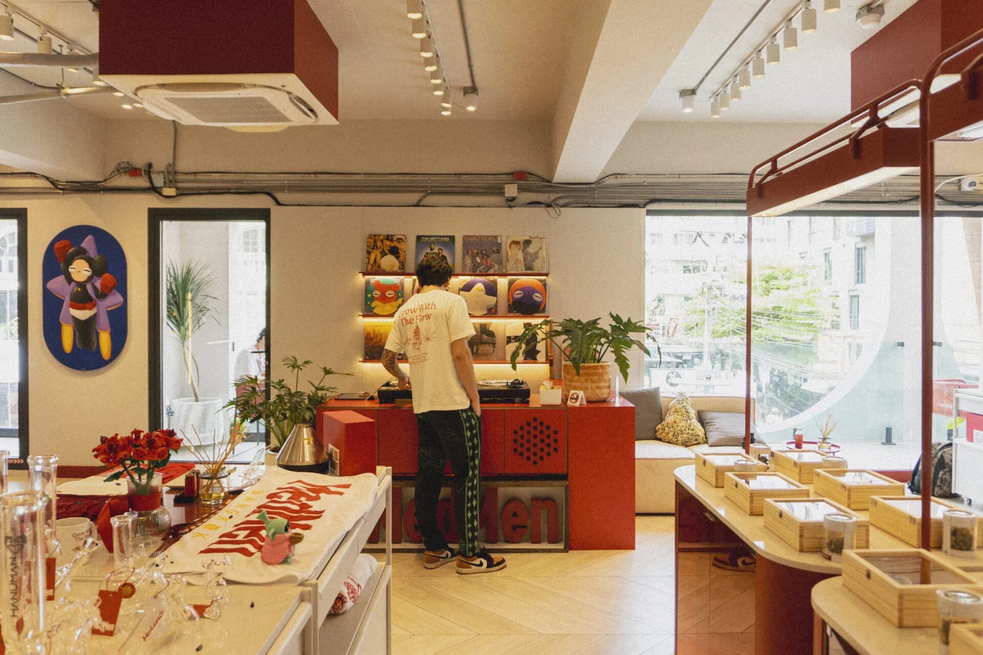 MedMen x BlackZang Bangkok interior, red counter and vinyl records